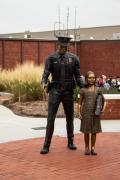 Standing Officer and Girl - Police Memorial at Mount Holly NC by Ed Walker